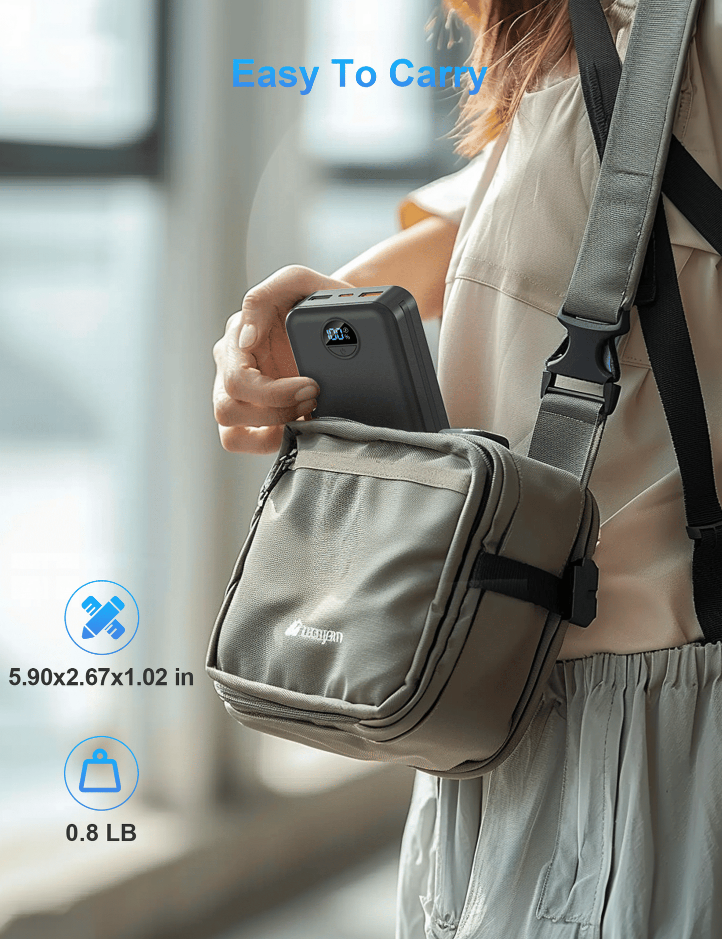 compact portable power bank being placed into a small shoulder bag for easy carrying